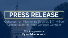 Capitol with overlay. Caption: Congressman Mackenzie Secures $47 Million Appropriation for Mack Defense Contract